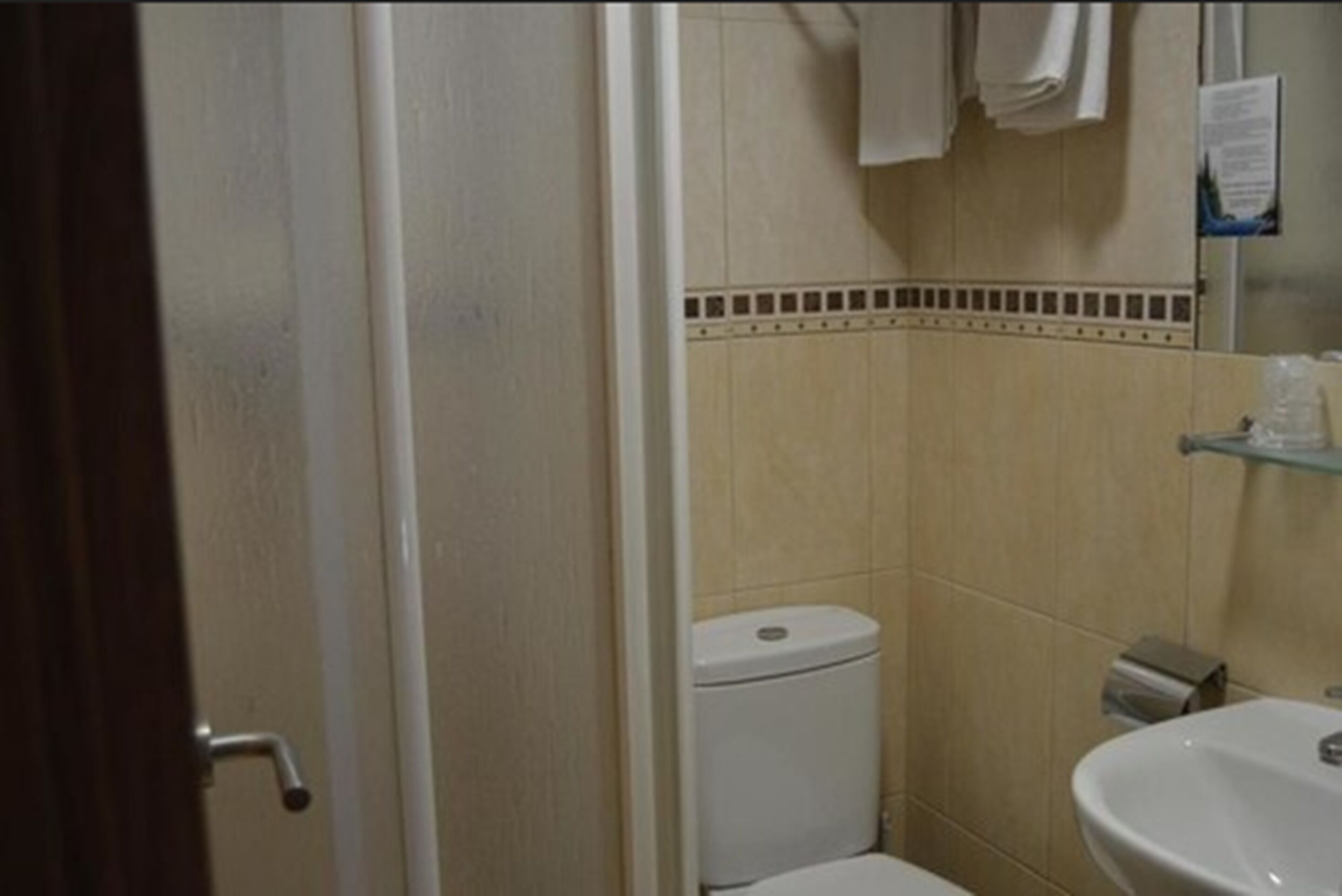 single room | bathroom | shower, hair dryer, towels, soap