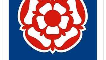 Una bandera con un diseño similar a una flor en rojo y blanco, y tres estrellas blancas.