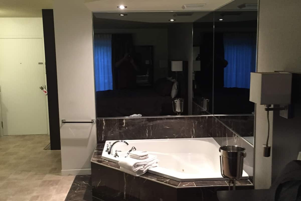 presidential suite, 1 king bed with sofa bed, hot tub | select comfort beds, desk, laptop workspace, blackout curtains