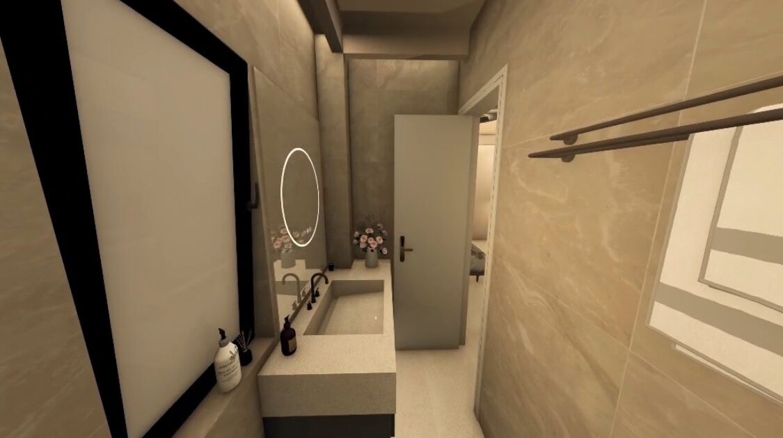 A narrow hallway with a bathroom on the right, featuring a sink, mirror, and toiletries.