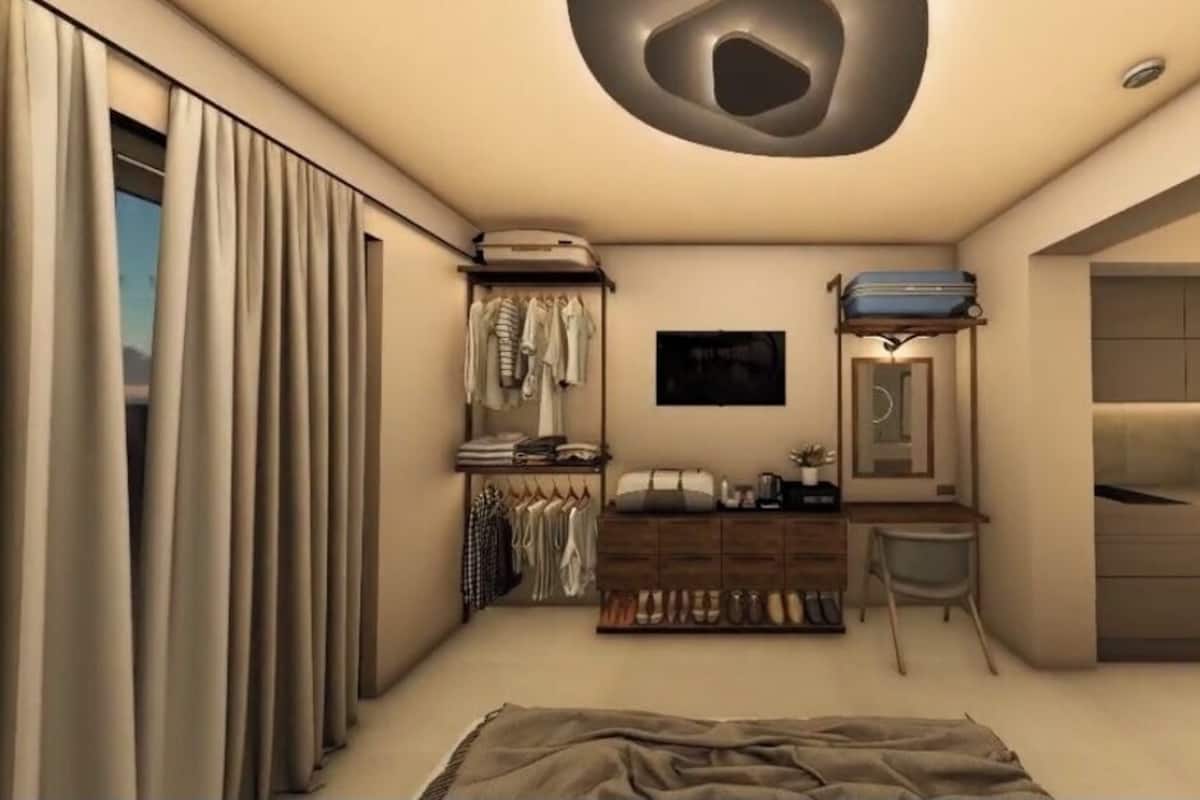Un dormitorio moderno con cama, mesita de noche, cómoda y espejo.