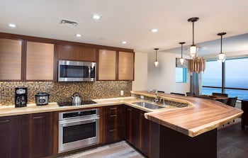 Full-size fridge, microwave, oven, stovetop at Hilton Grand Vac Club The Grand Islander Waikiki Honolulu