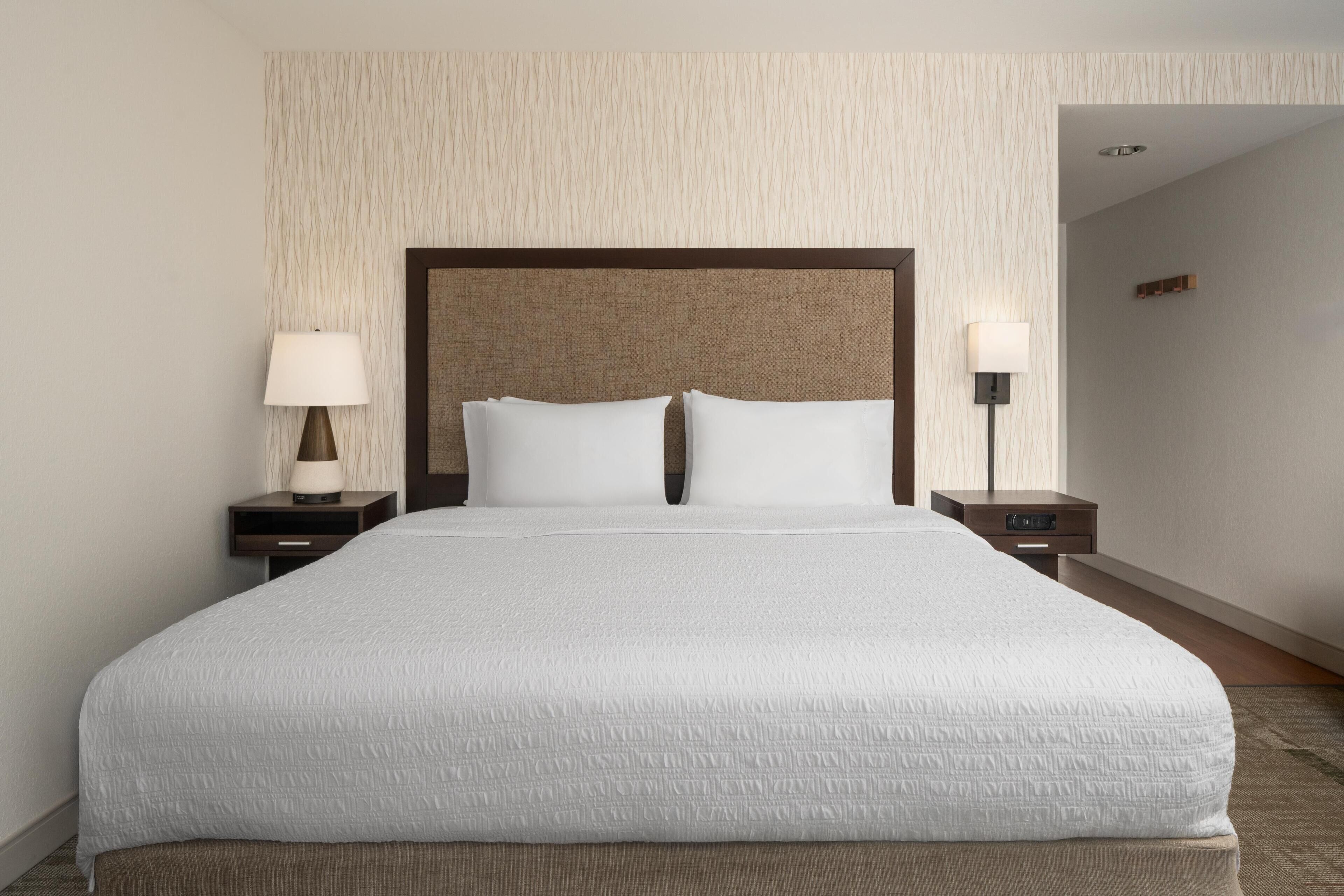 Premium bedding, desk, iron/ironing board, free cribs/infant beds