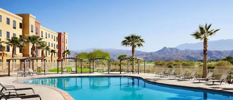 Outdoor pool, open 9:00 AM to 10:00 PM, sun loungers