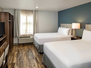 Premium bedding, desk, laptop workspace, blackout curtains - WoodSpring Suites Las Colinas - Northwest Dallas (Irving)