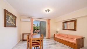 Standard Apartment (Family) | Living area | Flat-screen TV