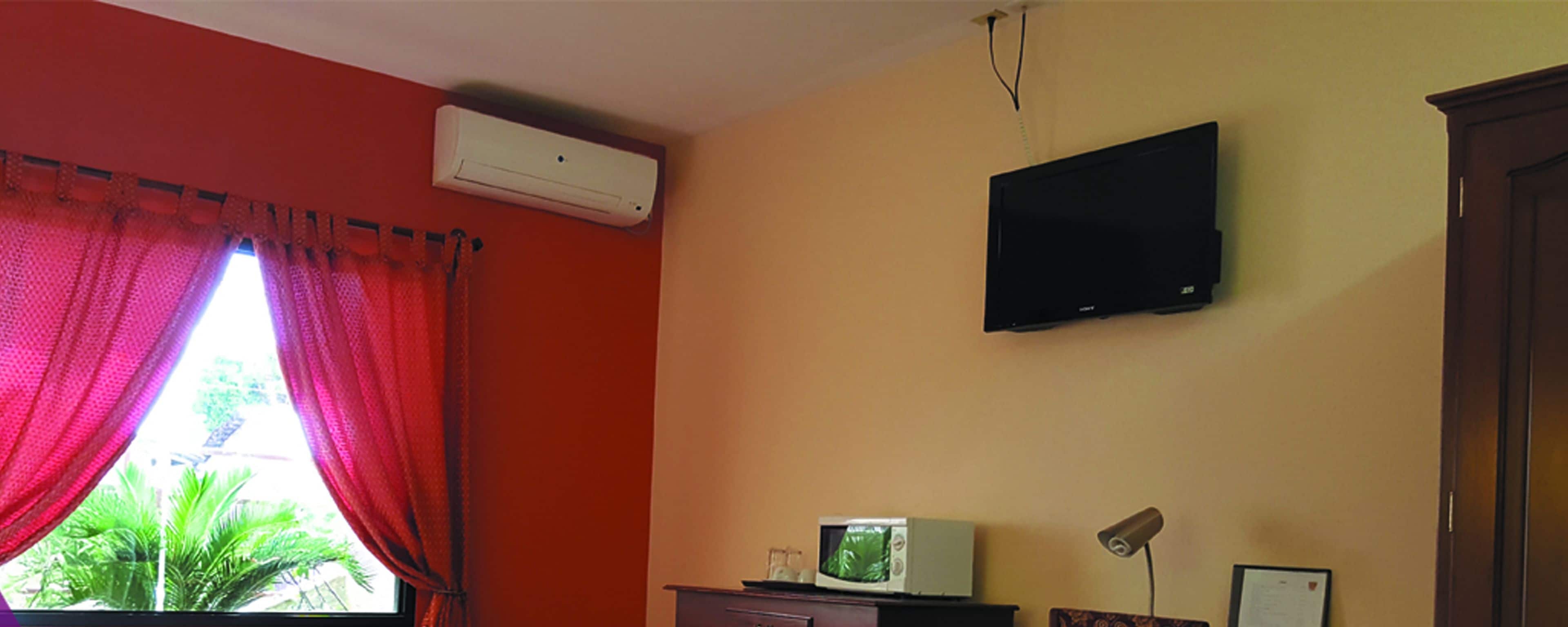 premium suite, 1 bedroom, refrigerator & microwave, corner | 1 bedroom, desk, iron/ironing board, free wifi