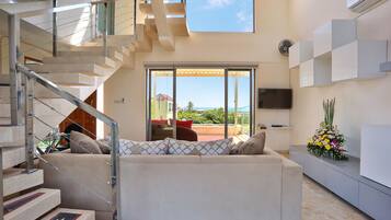 Duplex Balcony Penthouse Jarrah | Living room | 42-inch LED TV with cable channels, TV, video game console