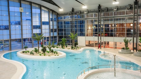Indoor pool, pool loungers. The Jangle Hotel Paris Charles de Gaulle Airport