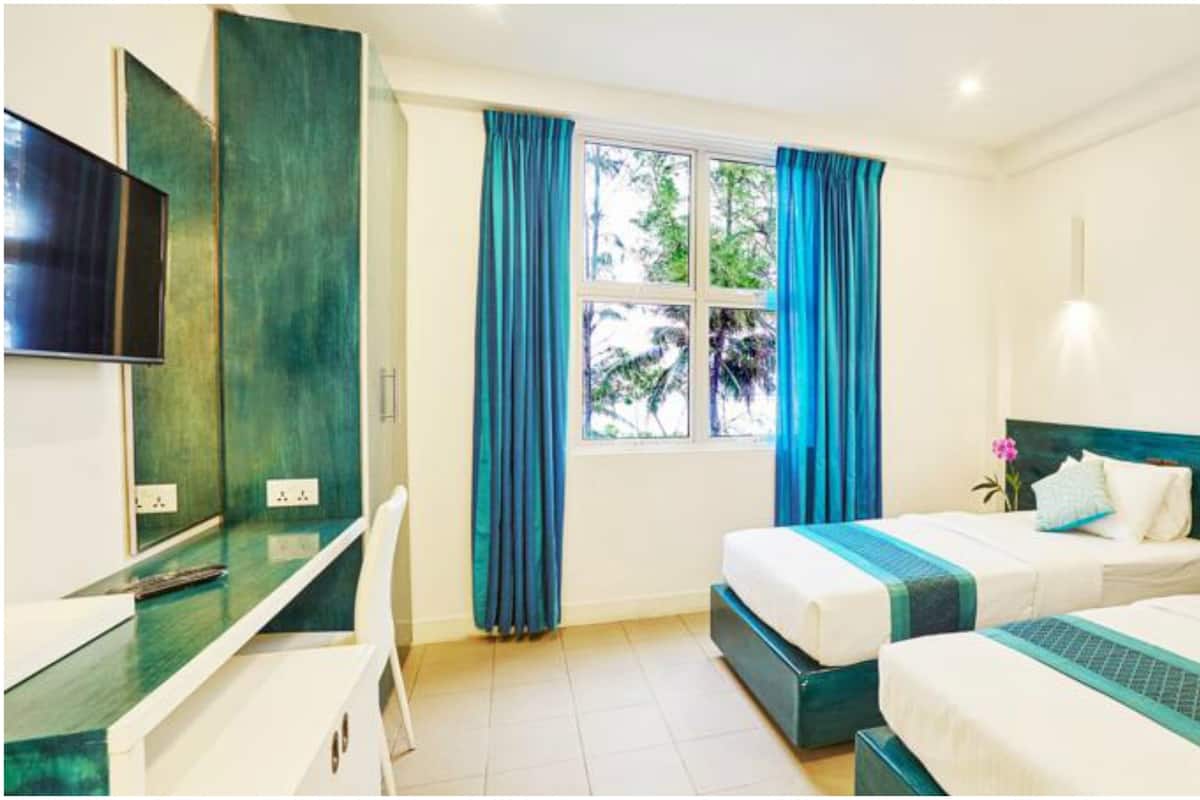 Phòng đôi hoặc 2 giường đơn Deluxe, quang cảnh biển | 1 phòng ngủ, bộ đồ giường cao cấp, minibar, két bảo mật tại phòng