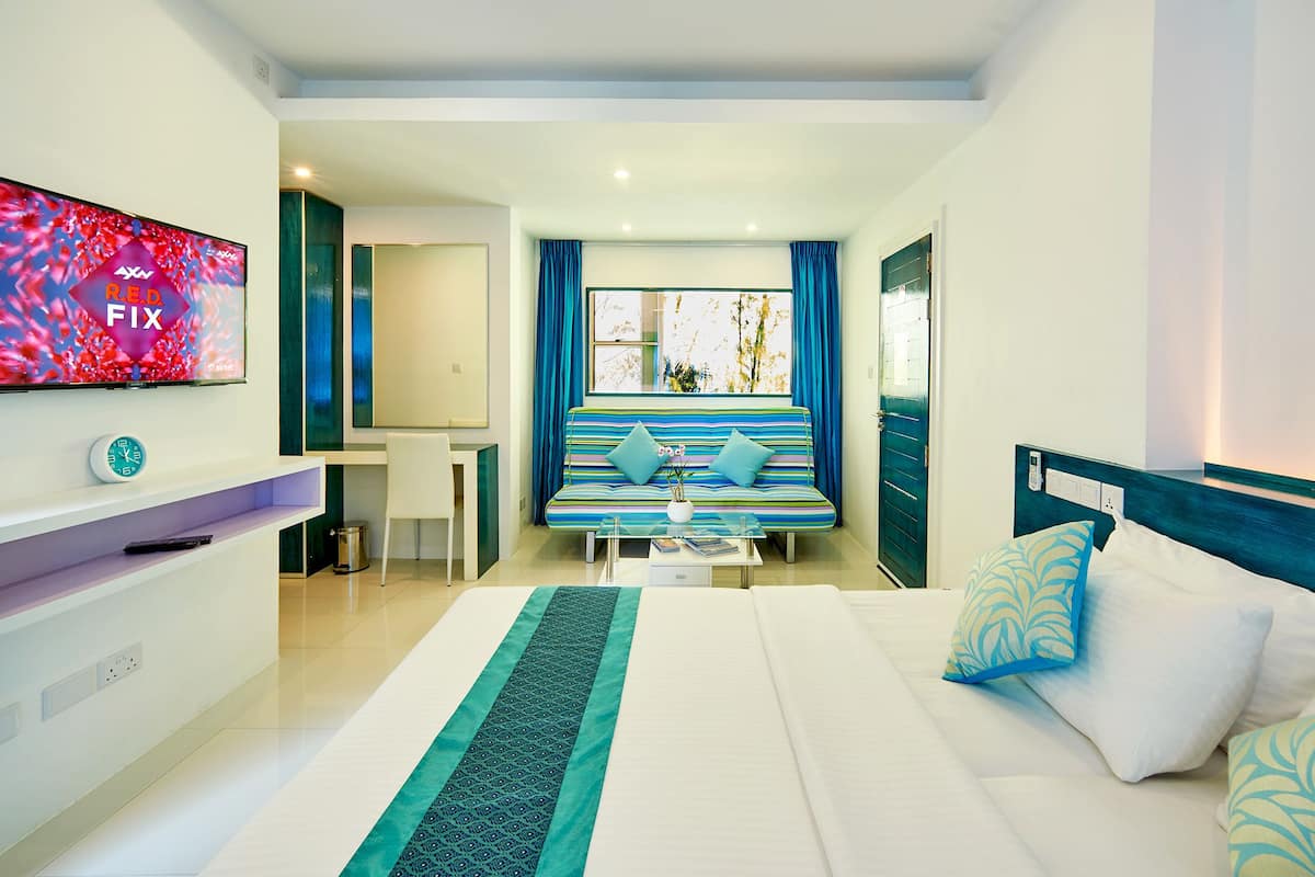 Family Quadruple Room, 1 Bedroom, Partial Sea View, Beachside | 1 bedroom, premium bedding, minibar, in-room safe