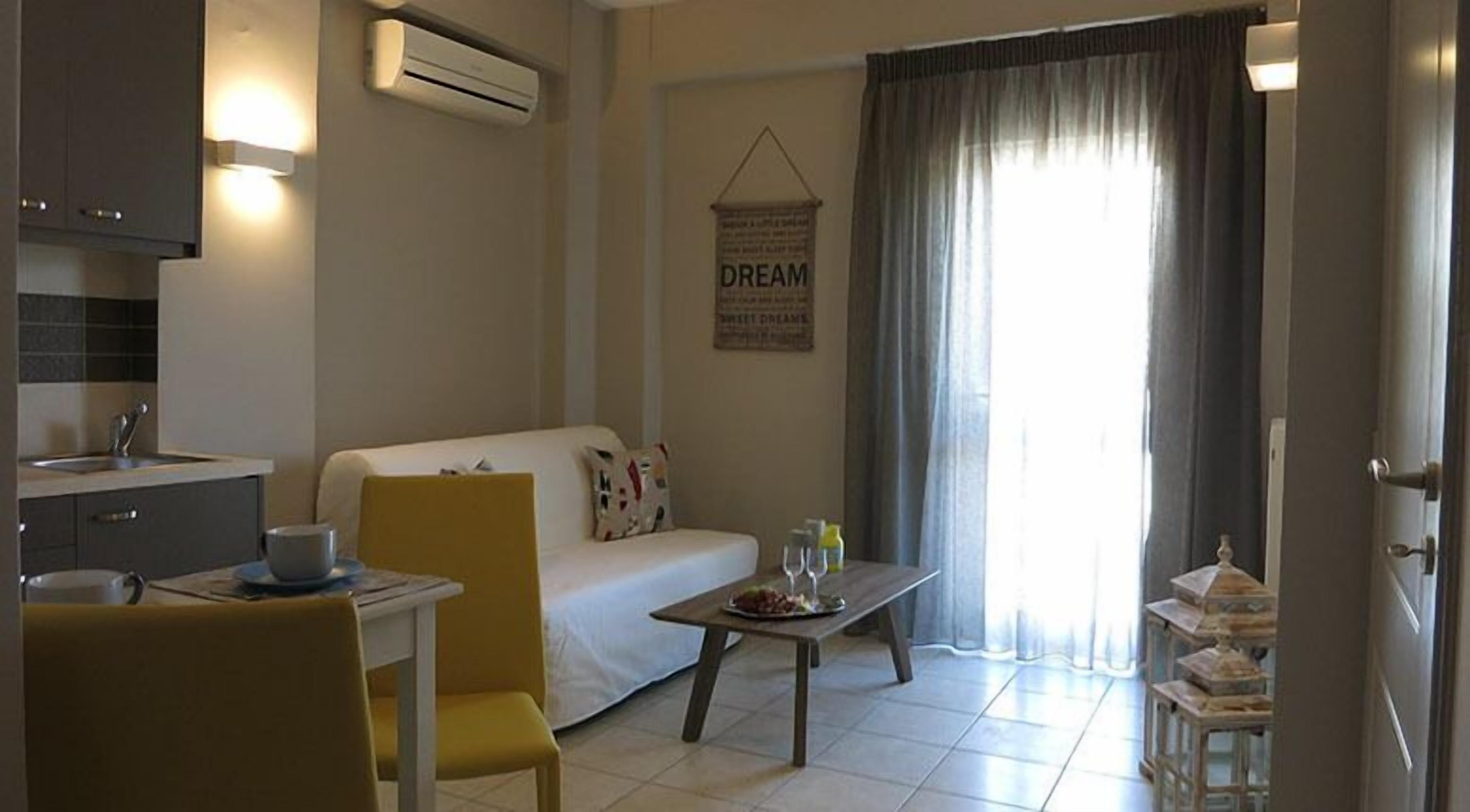 Apartment, Sea View | Living area | Flat-screen TV