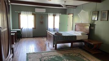 Family Triple Room, 1 Bedroom, Bathtub, Garden View | 1 bedroom, individually decorated, individually furnished, rollaway beds