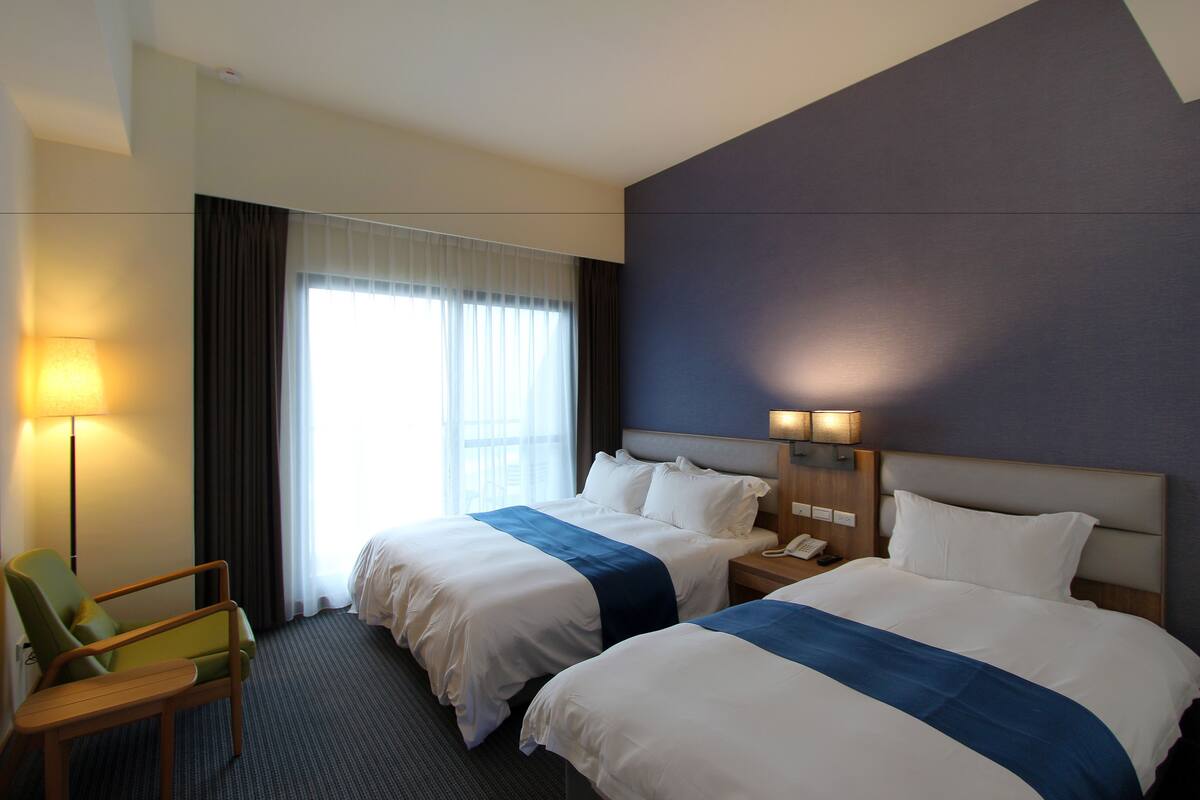 Chambre Triple Luxe, vue océan | Literie de qualité supérieure, coffres-forts dans les chambres