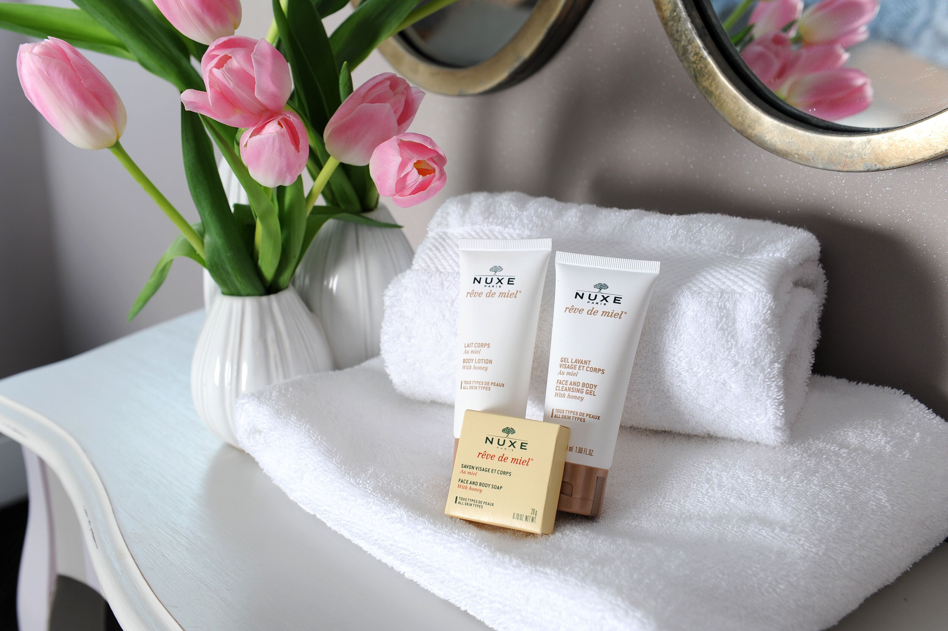 designer toiletries, hair dryer, towels, soap