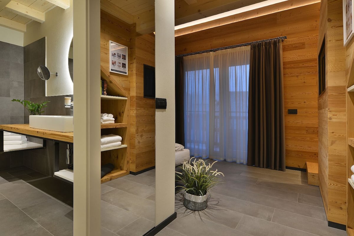 family triple room | living area | flat-screen tv