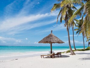 On the beach, sun-loungers, beach umbrellas, beach towels - The Sands Beach Resort Zanzibar (Dongwe)
