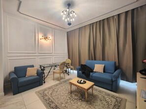 Luxury Apartment | Living area | Flat-screen TV