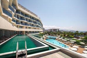 Deluxe Suite, 1 Double Bed, Sea View, Poolside | Pool | Outdoor pool, pool umbrellas, pool loungers