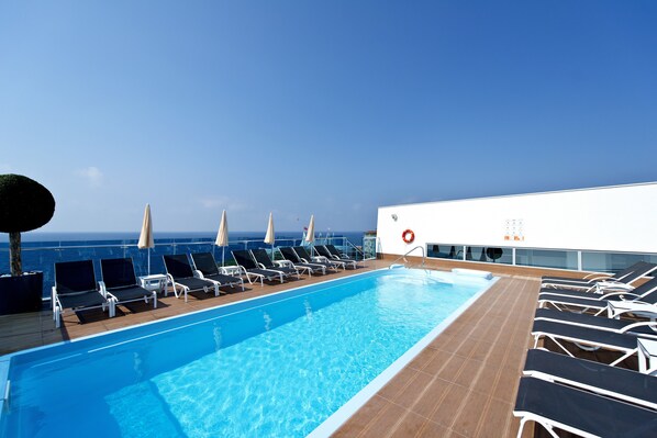 Outdoor pool, pool umbrellas, pool loungers