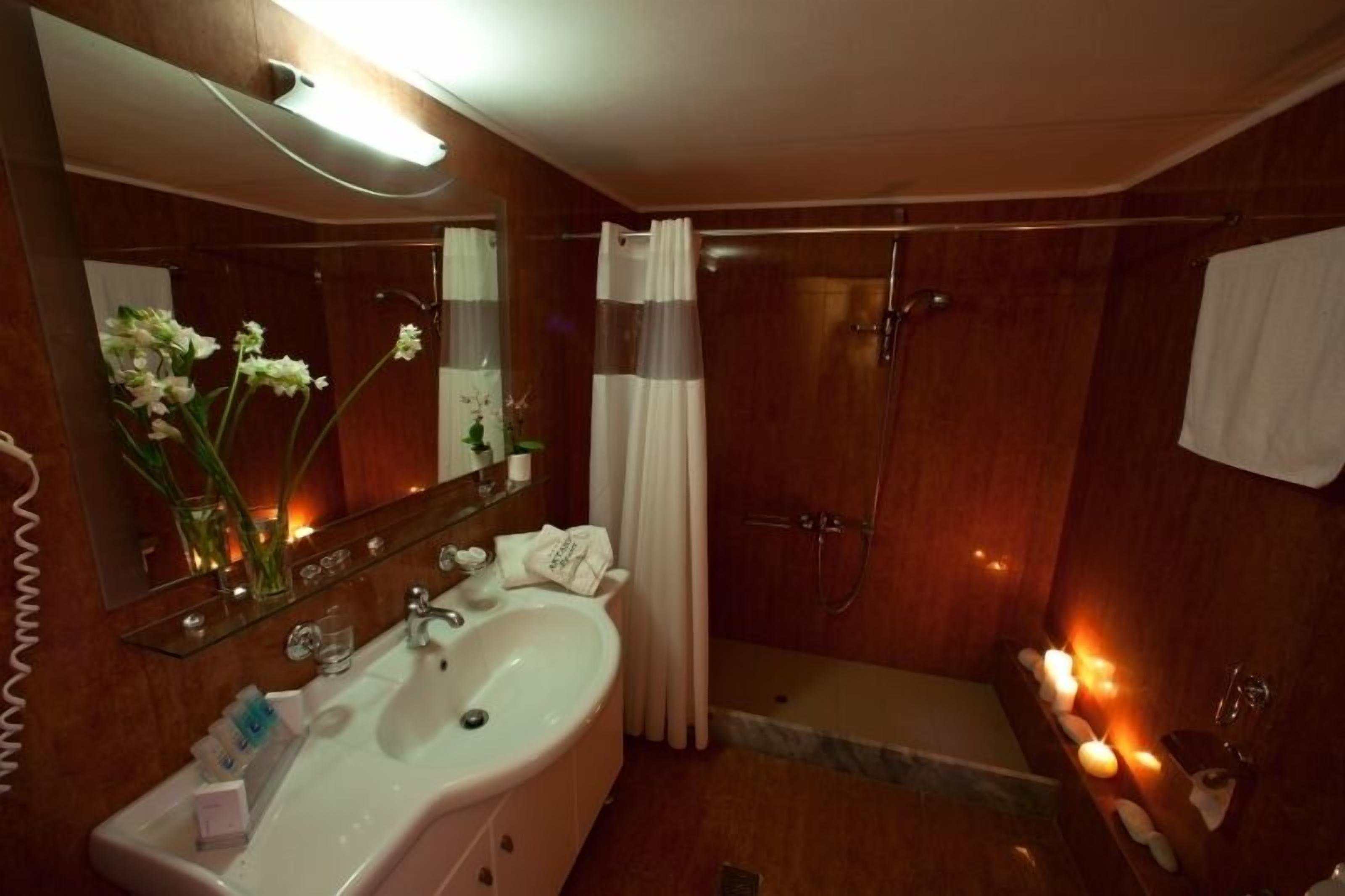 twin room | bathroom | designer toiletries, hair dryer, towels