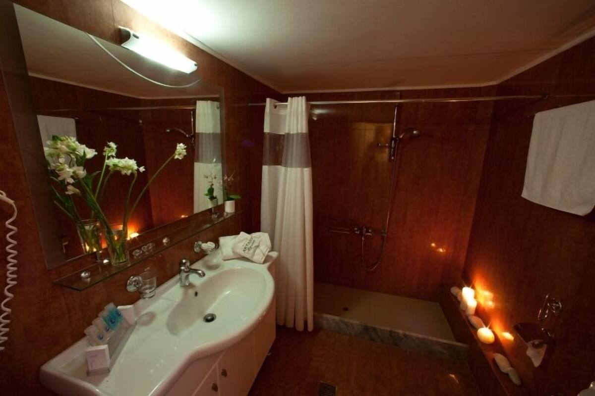 twin room | bathroom | designer toiletries, hair dryer, towels