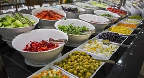 A buffet with various food options including vegetables, fruits, and olives. - Miss Cleopatra Hotel (Alanya)