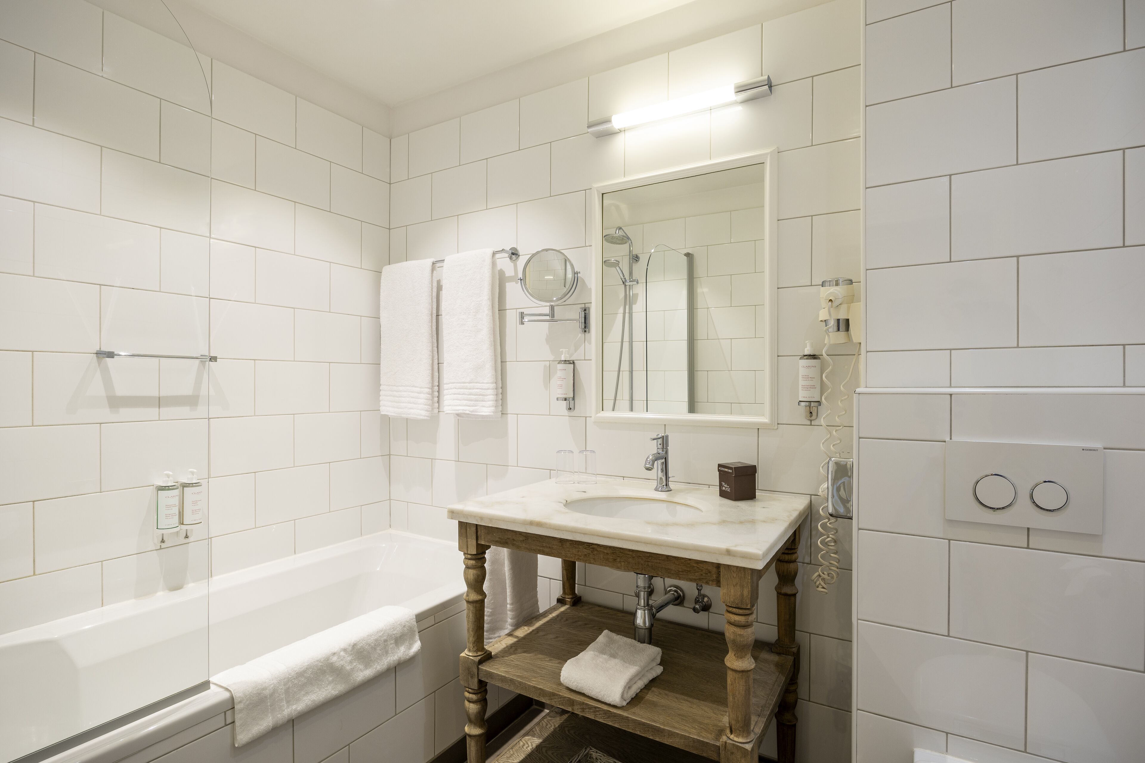 superior twin room | bathroom | designer toiletries, hair dryer, towels