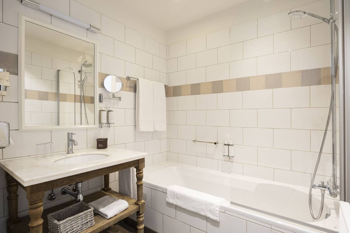 superior room | bathroom | designer toiletries, hair dryer, towels