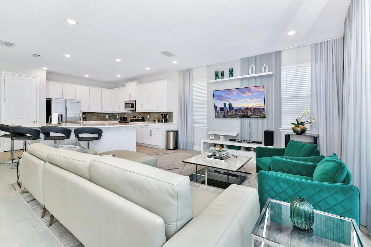 elite house, 6 bedrooms, private pool (westside) | living area | 50-inch flat-screen tv with cable channels, tv