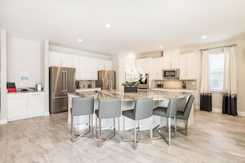 Elite House, Private Pool (12 Bedrooms Westside) | Private kitchen | Full-size fridge, microwave, oven, stovetop at Encore Resort and Water Park at Reunion by Rentyl