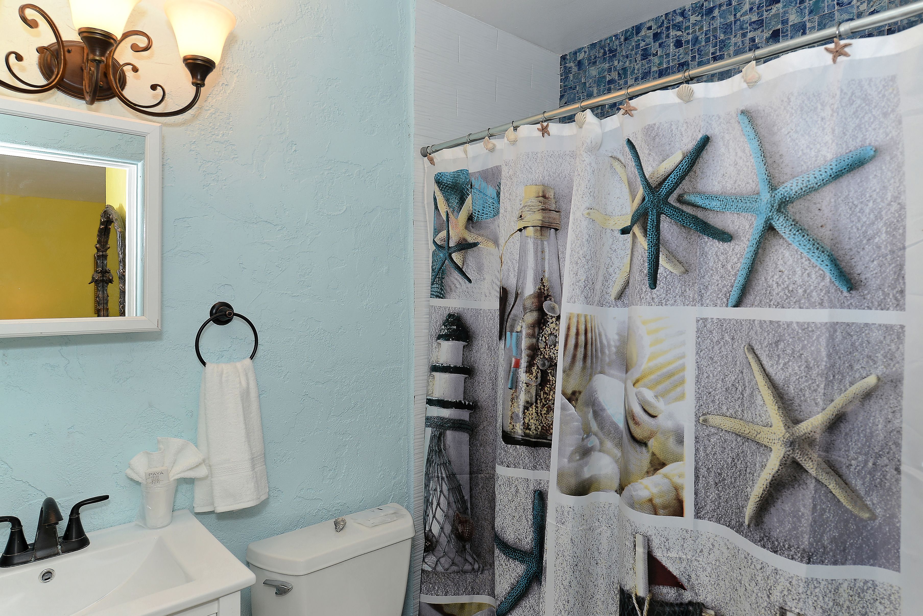 courtyard studio suite (1 queen bed and 1 sofabed) | bathroom | shower, free toiletries, hair dryer, towels