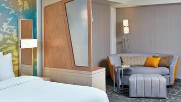 Premium bedding, desk, laptop workspace, blackout drapes