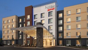 A multi-story hotel with a modern facade, a covered entrance, and a Marriott logo. - Fairfield Inn & Suites Lancaster East at The Outlets (Lancaster)