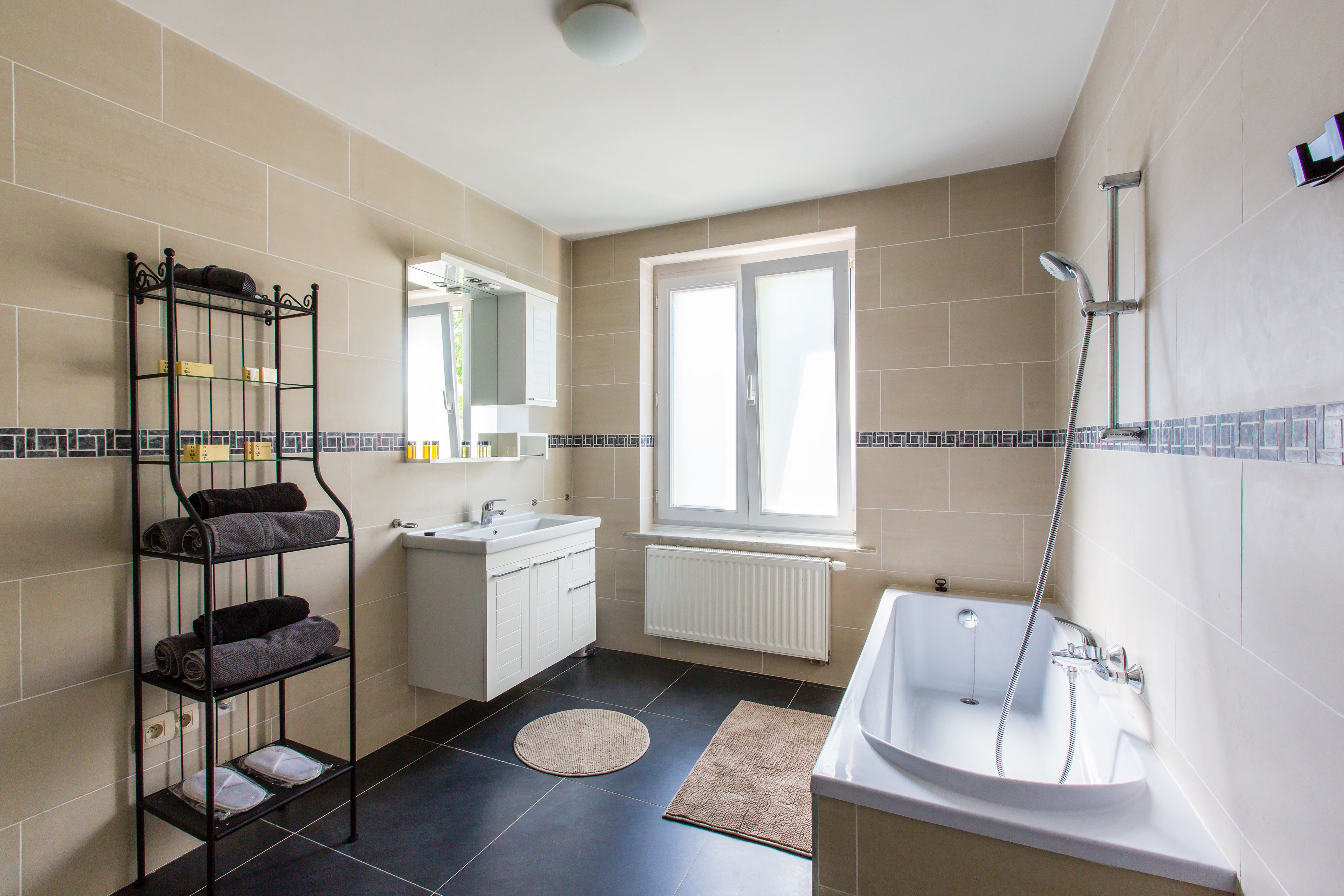 deluxe apartment | bathroom | free toiletries, hair dryer, slippers, towels