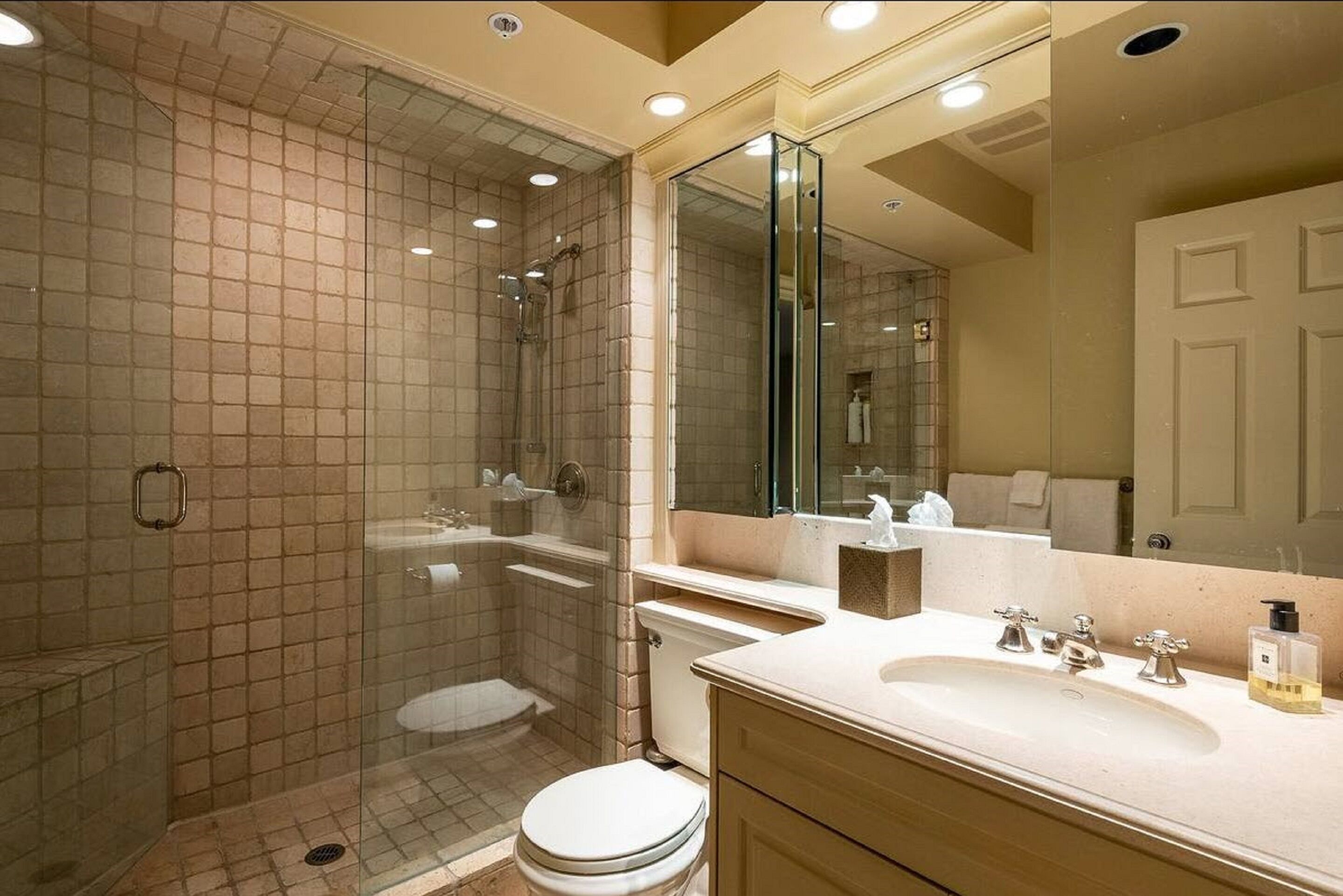 the fitzsimmons suite | bathroom | rainfall showerhead, hair dryer, towels, soap