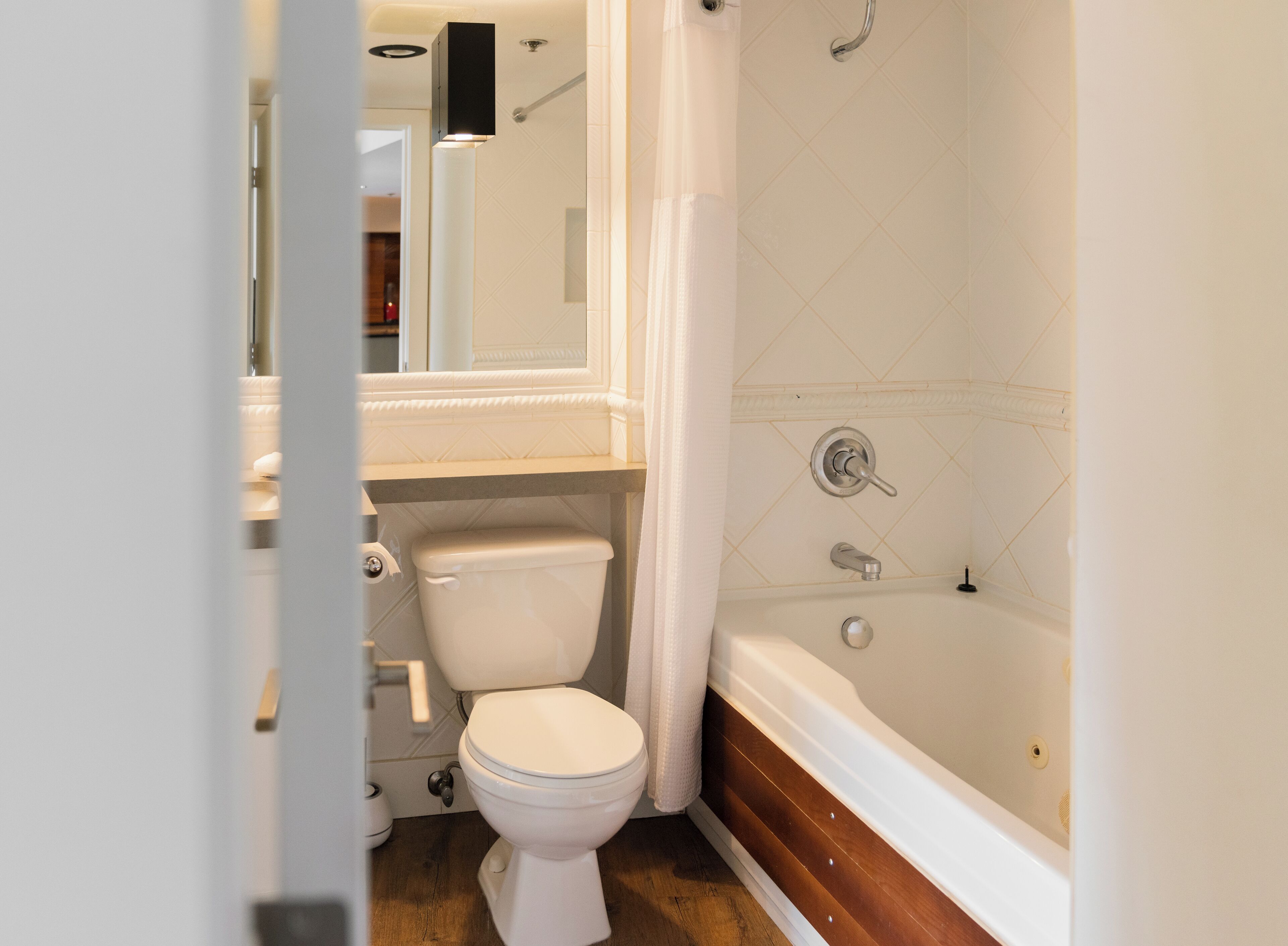 the whistler blackcomb suites | bathroom | rainfall showerhead, hair dryer, towels, soap