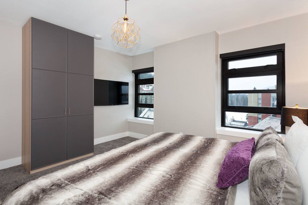 the penthouse | 1 bedroom, laptop workspace, blackout curtains, iron/ironing board