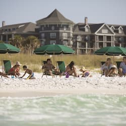 On the beach, white sand, sun loungers, beach umbrellas