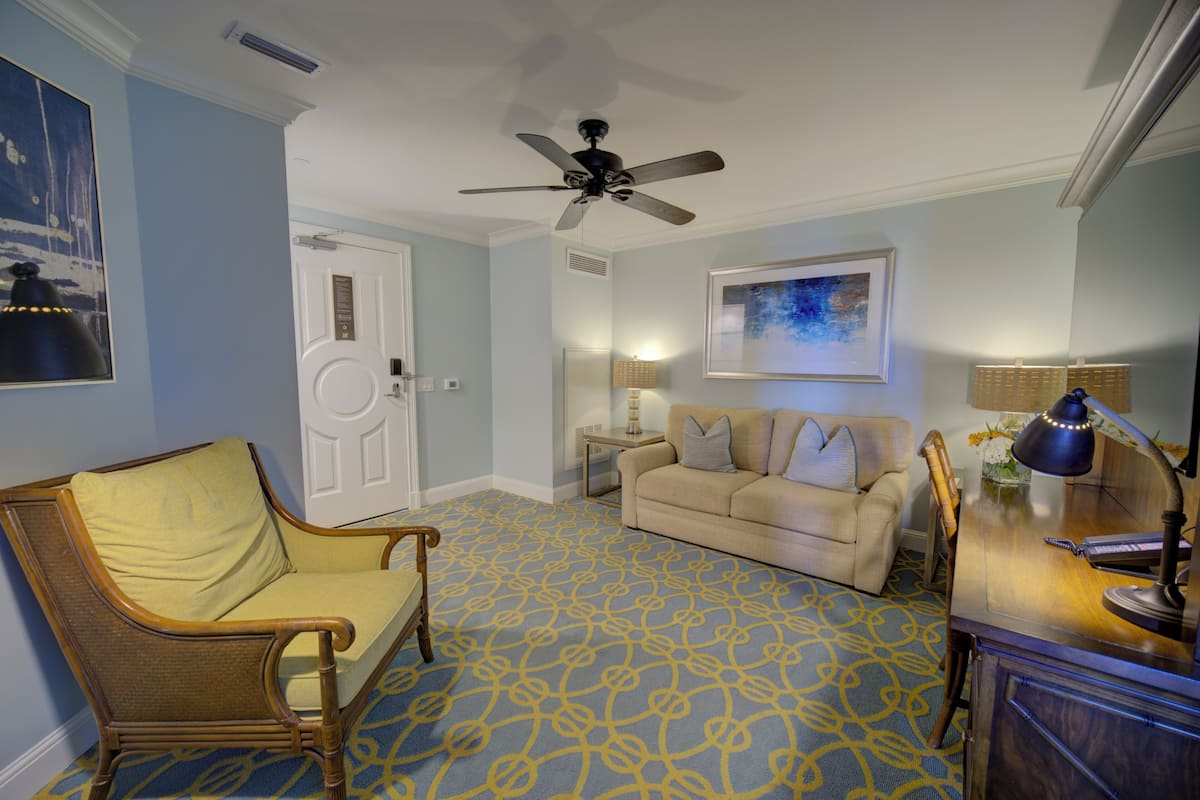Suite, 2 Queen Beds, Accessible, Pool View | Living area | 43-inch LED TV with digital channels, TV, iPod dock