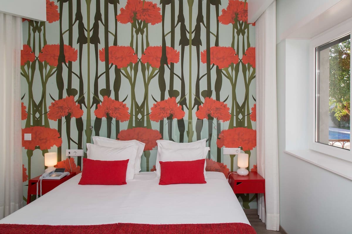 Deluxe Double or Twin Room, Pool Access (Liberdade) | Premium bedding, pillowtop beds, in-room safe, desk