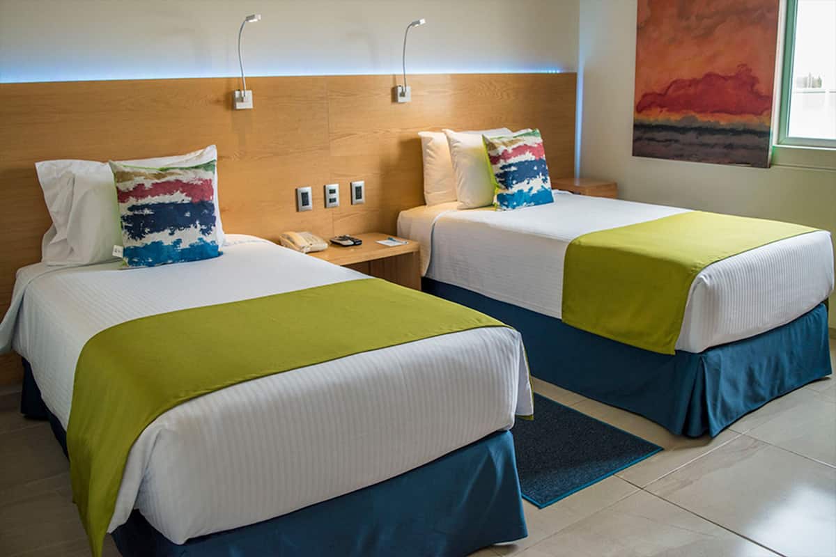 room, 2 single beds | premium bedding, down duvets, in-room safe, individually decorated