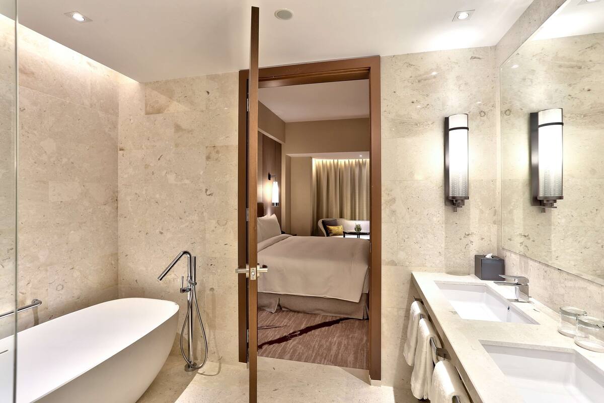 suite, 1 bedroom, bathtub | bathroom | designer toiletries, hair dryer, slippers, bidet
