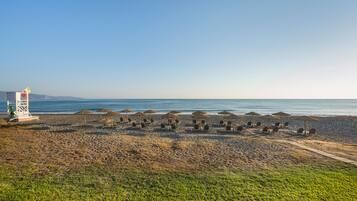 On the beach, sun-loungers, beach umbrellas