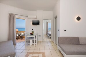Suite, 1 Bedroom, Beachside | Living area | LCD TV - Caretta Beach (Platanias)