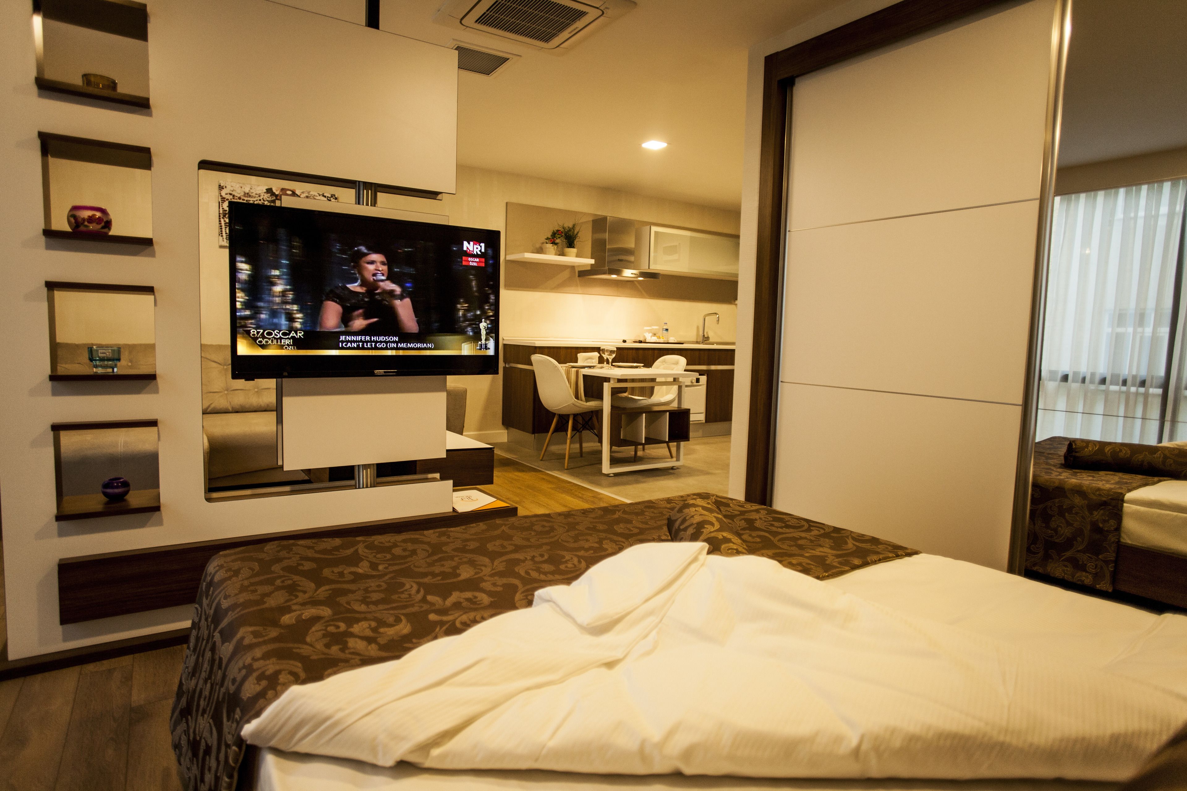 junior suite | bathroom | shower, hair dryer, slippers, towels