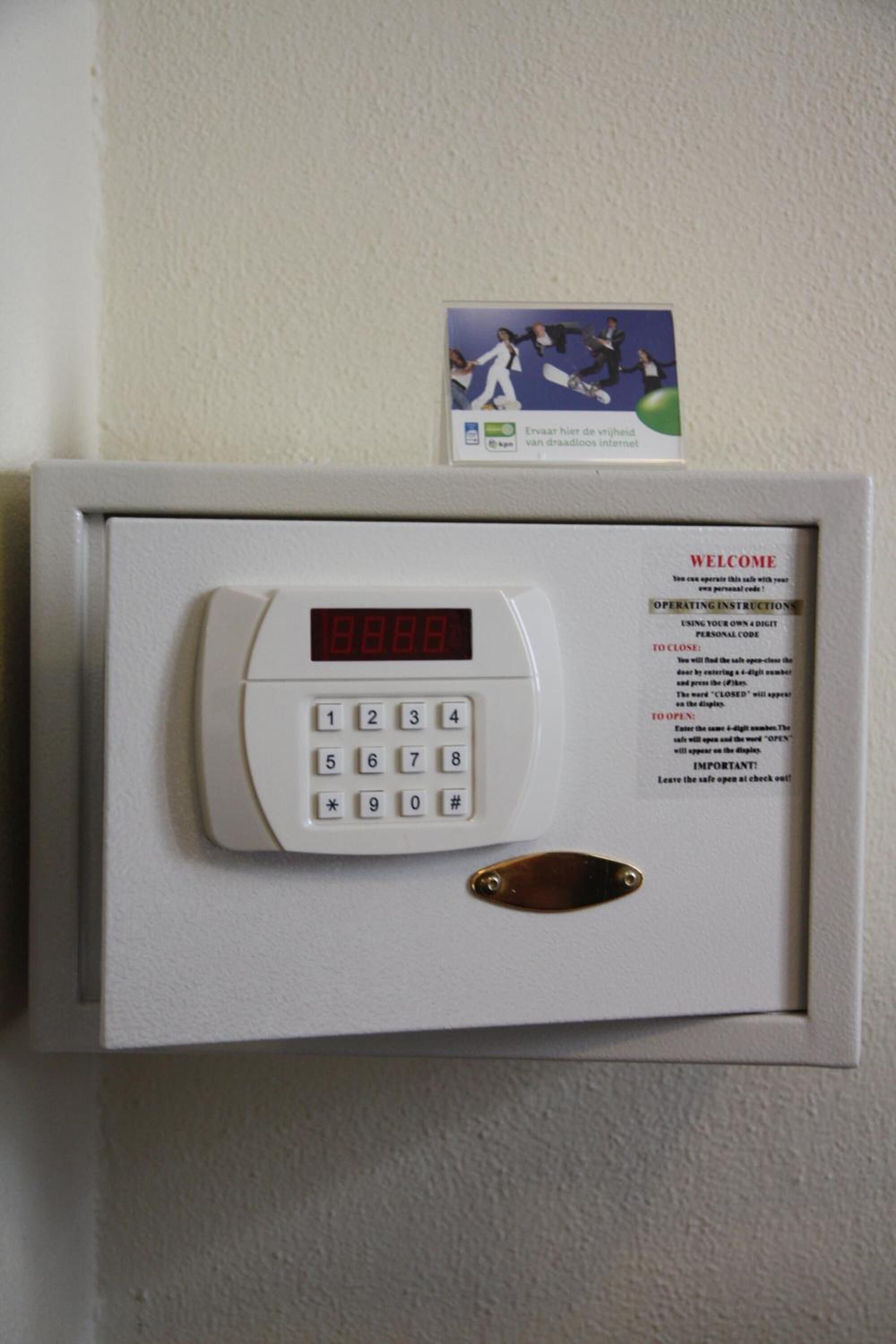 A digital keypad lock with a welcome sign and operating instructions.