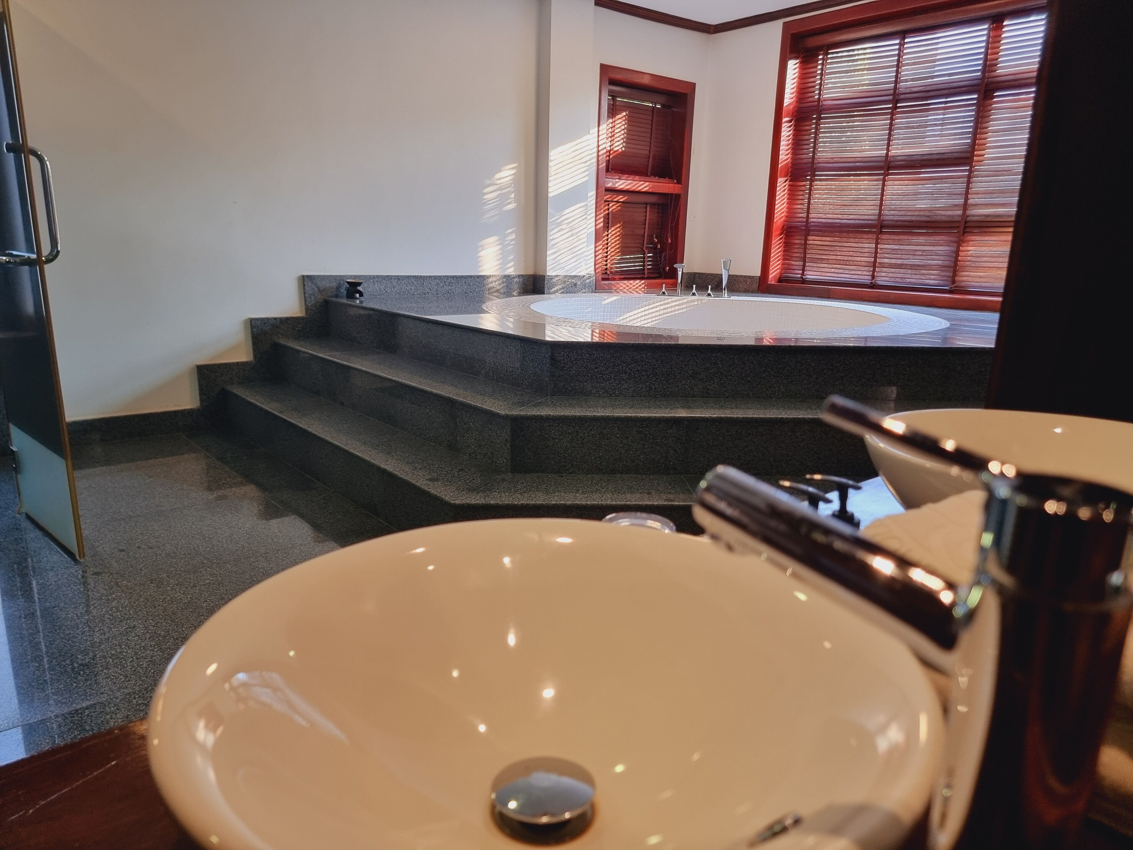 presidential suite, 1 king bed, balcony, pool view | bathroom | free toiletries, hair dryer, bathrobes, slippers