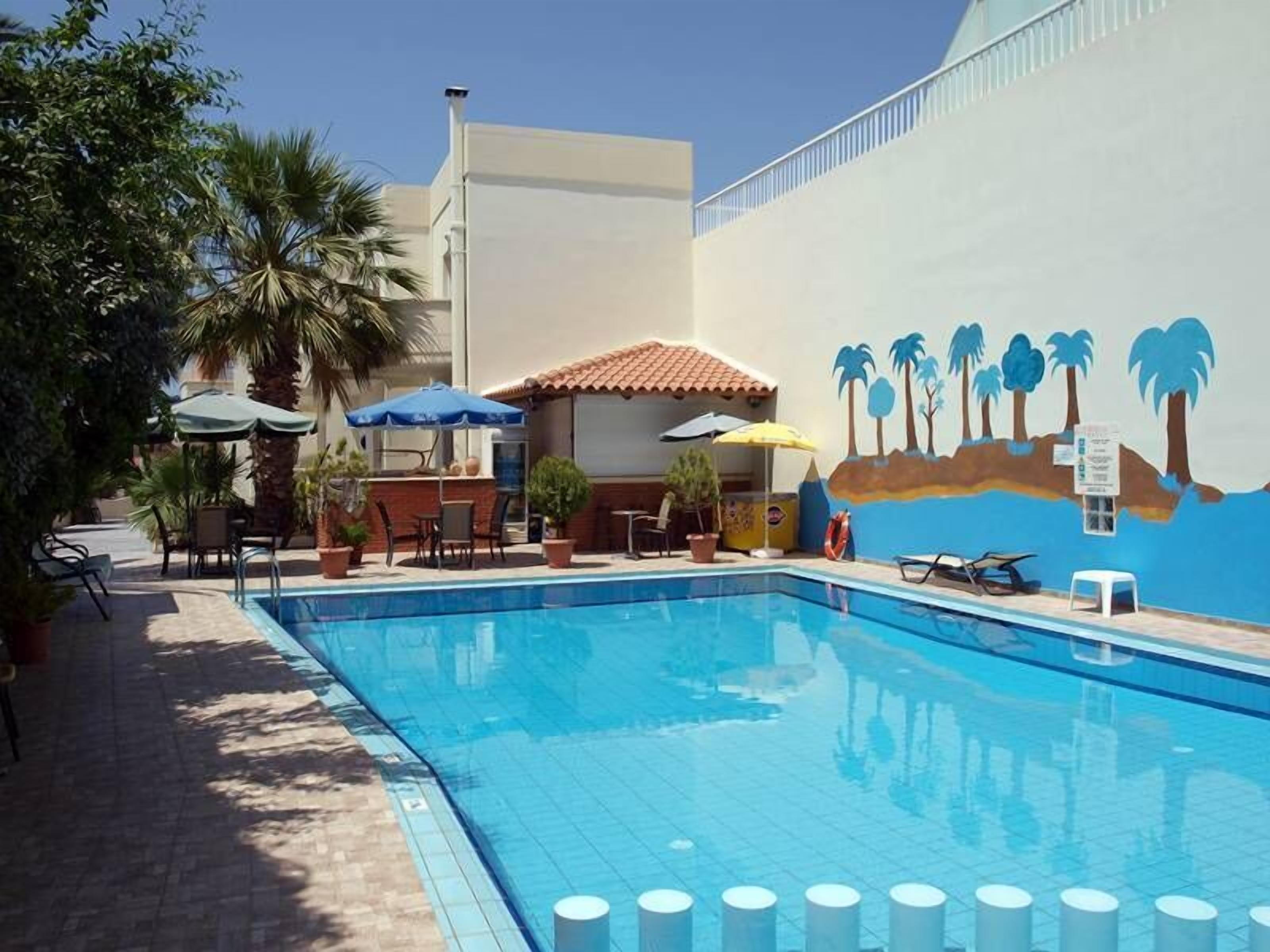 Outdoor pool, open 8 AM to 8 PM, pool umbrellas, sun loungers