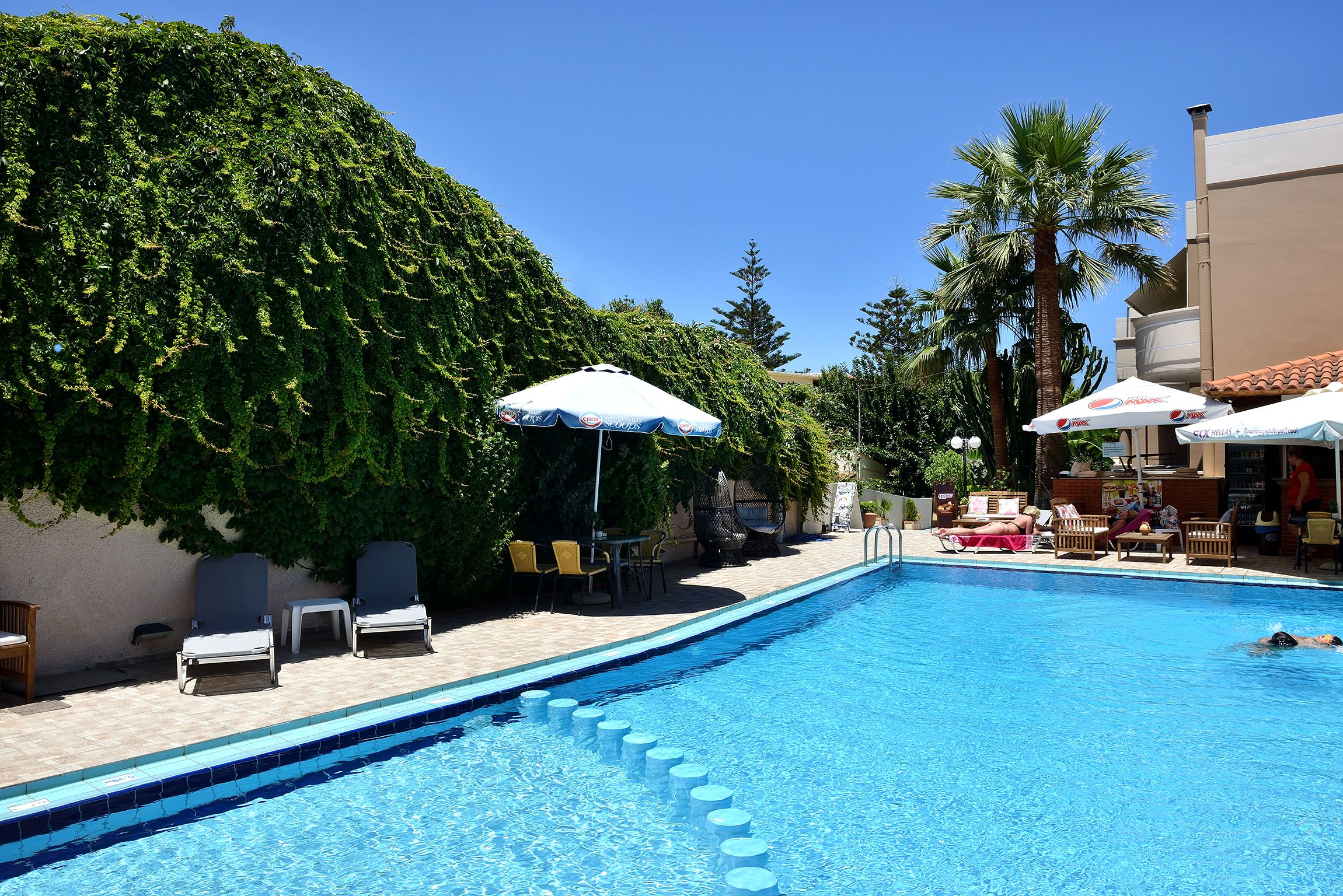 Outdoor pool, open 8 AM to 8 PM, pool umbrellas, sun loungers